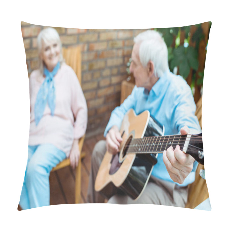 Personality  Selective Focus Of Retired Husband Playing Acoustic Guitar Near Wife  Pillow Covers