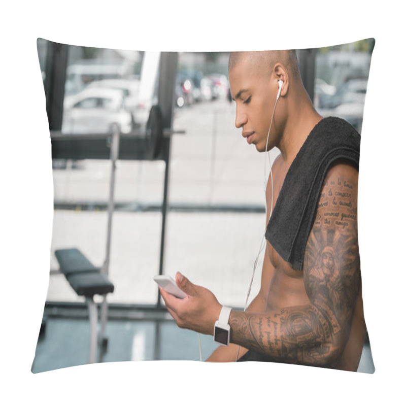 Personality  Side View Of Muscular Shirtless Young Man In Earphones Sitting And Using Smartphone In Gym Pillow Covers