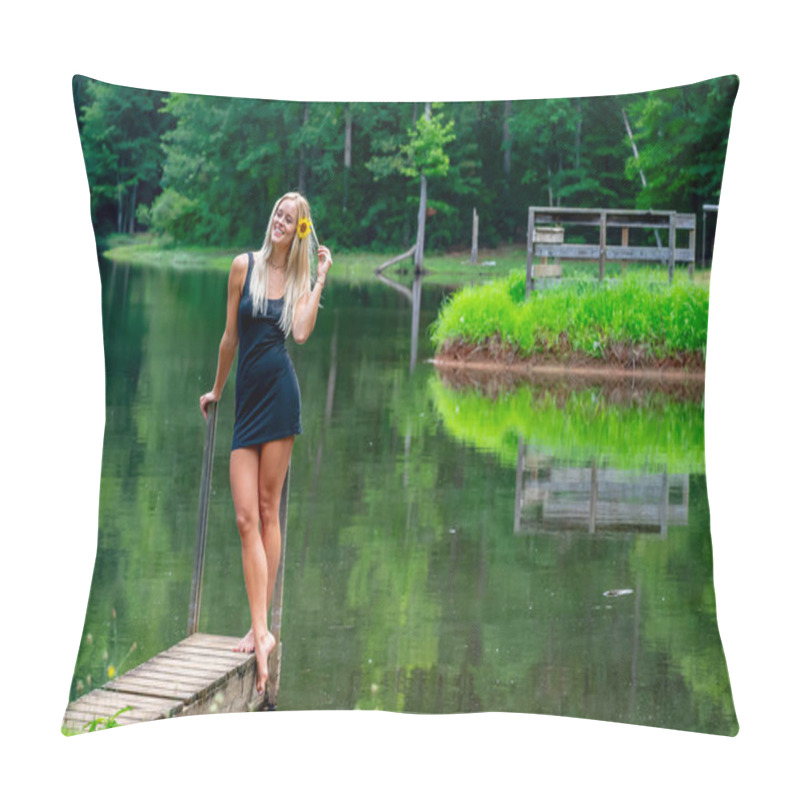 Personality  A Beautiful Blonde Woman In A Black Dress Poses Gracefully By A Serene Pond, Its Calm Water Reflecting The Lush Greenery Around Her. The Peaceful Setting And Vibrant Nature Evoke A Joyful, Uplifting Mood. Pillow Covers