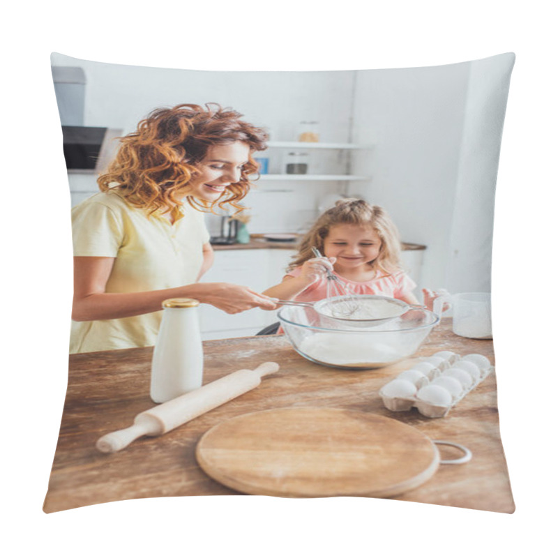 Personality  Selective Focus Of Mother And Daughter Sieving Flour Into Glass Bowl Near Eggs, Milk, Chopping Board And Rolling Pin Pillow Covers