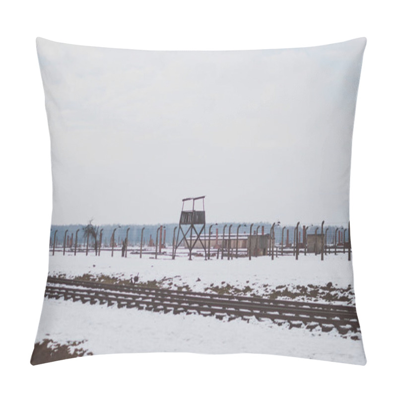 Personality  Oswiecim, Poland - February 16, 2018: Railway Tracks Of Auschwitz Concentration Camp And A Watchtower. Pillow Covers