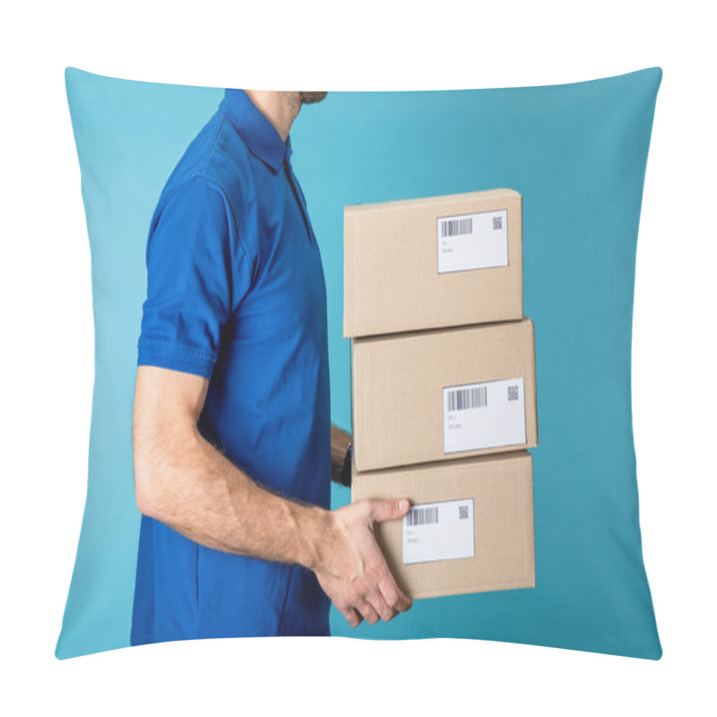 Personality  Side View Of Delivery Man Holding Cardboard Packages Isolated On Blue Pillow Covers