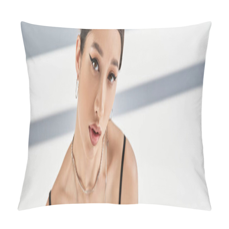 Personality  Portrait Of Charming Asian Woman With Brunette Hair, Bold Makeup, Silver Necklaces And Earrings Looking At Camera On Grey Background With Lighting And Shadows, Banner Pillow Covers