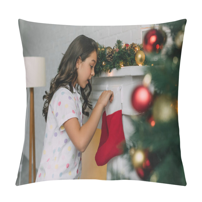 Personality  Side View Of Shocked Child In Pajama Looking At Christmas Stocking Near Fireplace At Home  Pillow Covers