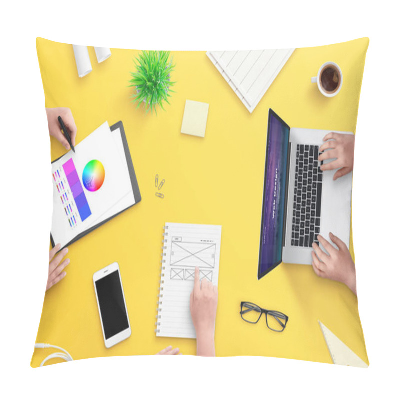 Personality  Team Work On Web Design Project. Top View, Flat Lay Scene With Laptop, Smart Phone, Plans, Papers And Coffee. Yellow Desk. Pillow Covers