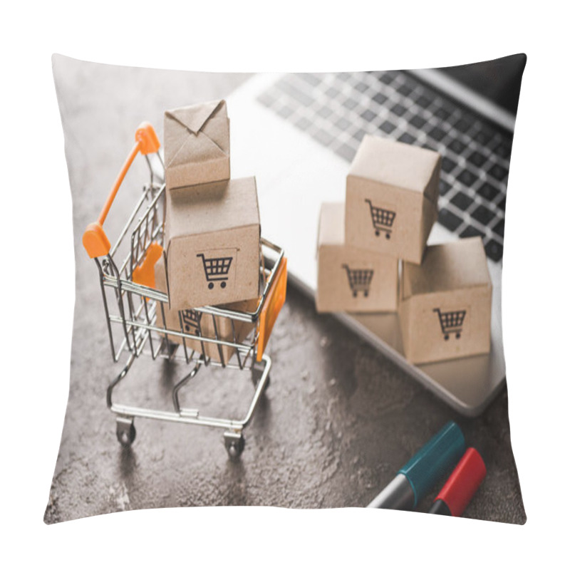 Personality  Selective Focus Of Toy Shopping Cart With Small Carton Boxes Near Laptop, E-commerce Concept Pillow Covers