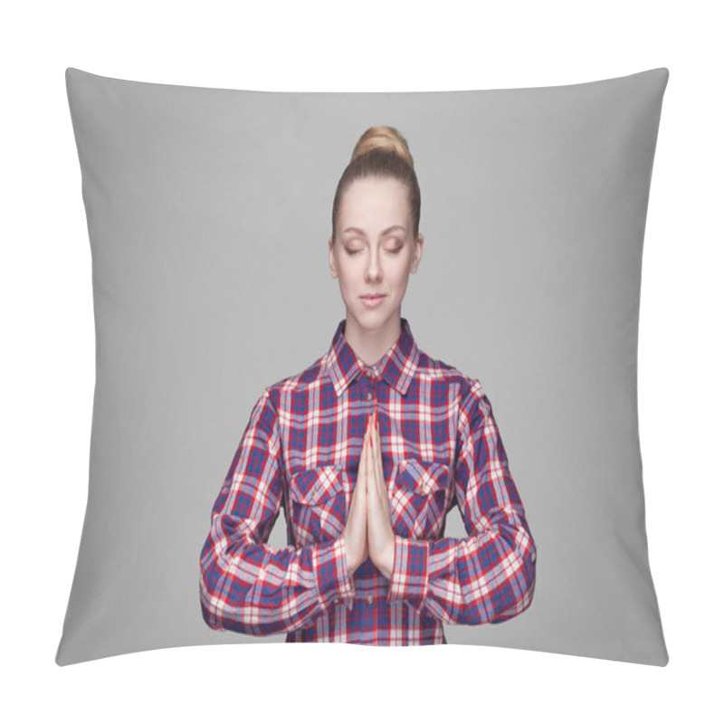 Personality  Portrait Of Calm Beautiful Blonde Woman In Pink Checkered Shirt With Collected Bun Hairstyle With Closed Eyes Showing Yoga Gesture And Meditating On Grey Background. Pillow Covers