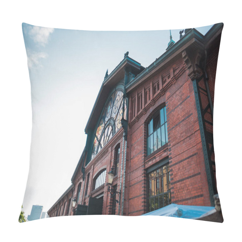 Personality  A Detailed View Of A Historic Brick Building Featuring Ornate Stained Glass Windows, Showcasing Architectural Elegance And Urban Charm Under A Clear, Bright Sky. Pillow Covers