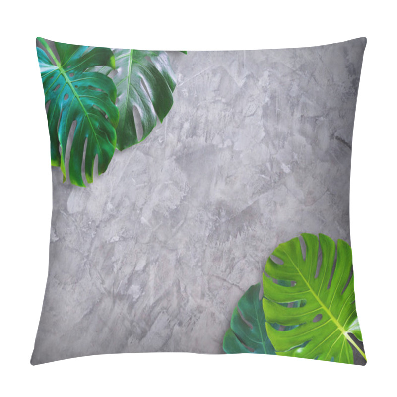 Personality  Top View Of Monstera Green Leaves Tropical Plant Isolated On Gray Cement Wall Background With Copy Space For Text Flat Lay Design. Pillow Covers