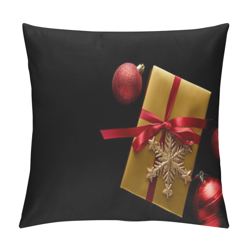 Personality  Top View Of Shiny Golden Christmas Gift With Red Ribbon And Snowflake Near Baubles Isolated On Black Pillow Covers