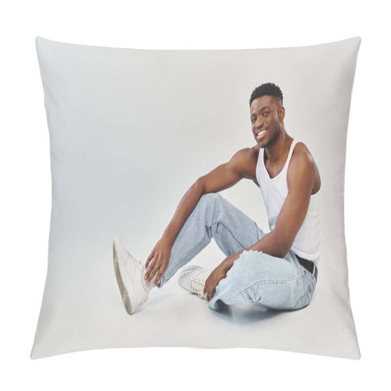 Personality  Young African American Man Sitting On The Ground, Legs Crossed, In A Studio Setting Against A Grey Background. Pillow Covers