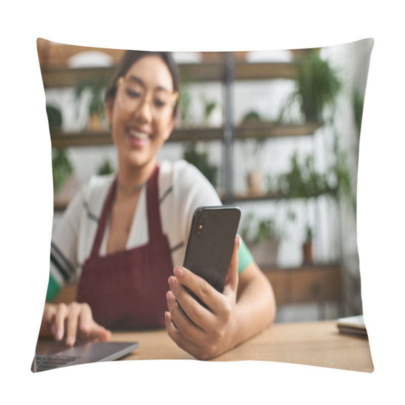 Personality  A Young Asian Woman In An Apron Uses Her Phone While Working In Her Plant Store. Pillow Covers