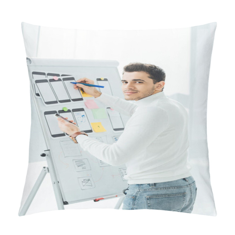 Personality  Side View Of Ux Designer Looking At Camera While Holding Smartphone Near Mobile Frameworks On Whiteboard  Pillow Covers