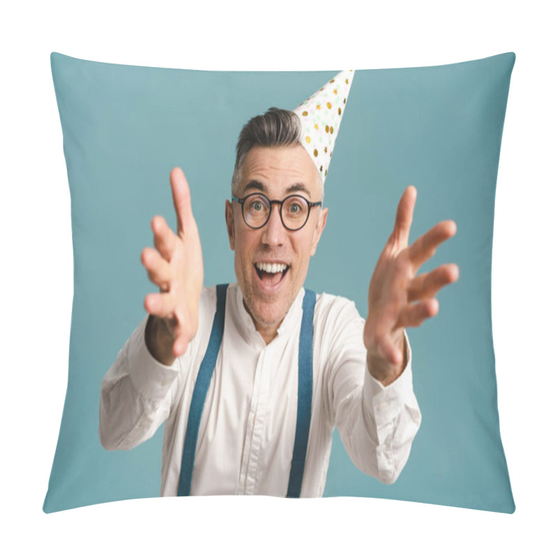 Personality  Excited Grey-haired Man In Party Cone Reaching His Arms To Camera Isolated Over Blue Background Pillow Covers