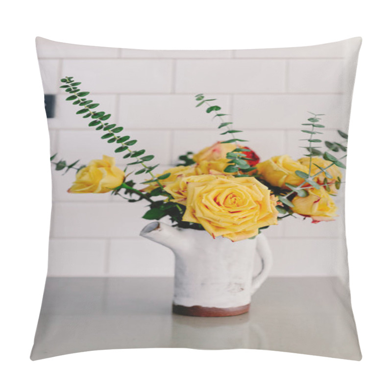 Personality  Yellow Large Roses And Eucalyptus Branches In The Ceramic Craft White Vase. Kitchen Counter Top. Lifestyle Bright Kitchen. Coffee Space In The Kitchen. Grey And White Colors. Bouquet Of Yellow Roses. Pillow Covers