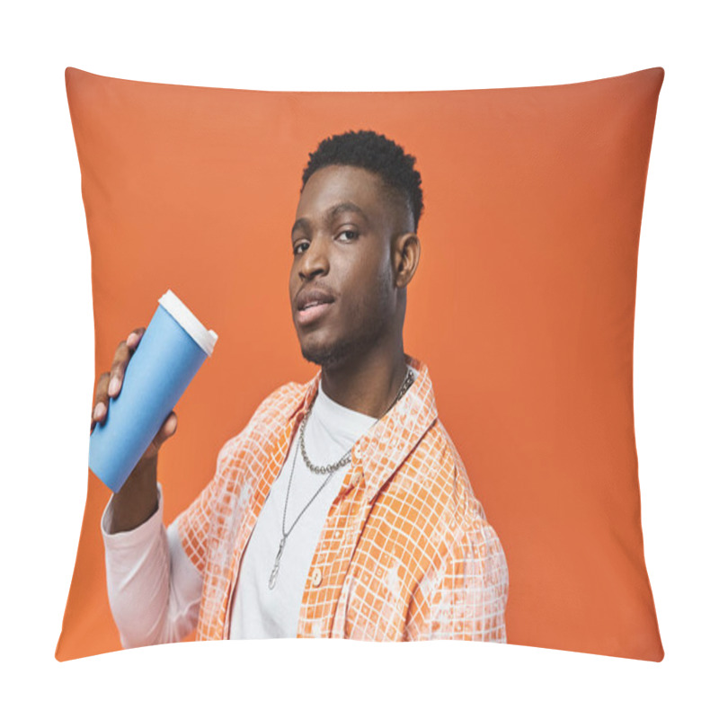 Personality  Handsome Young Man Enjoying A Hot Cup Of Coffee Against A Vibrant Orange Backdrop. Pillow Covers