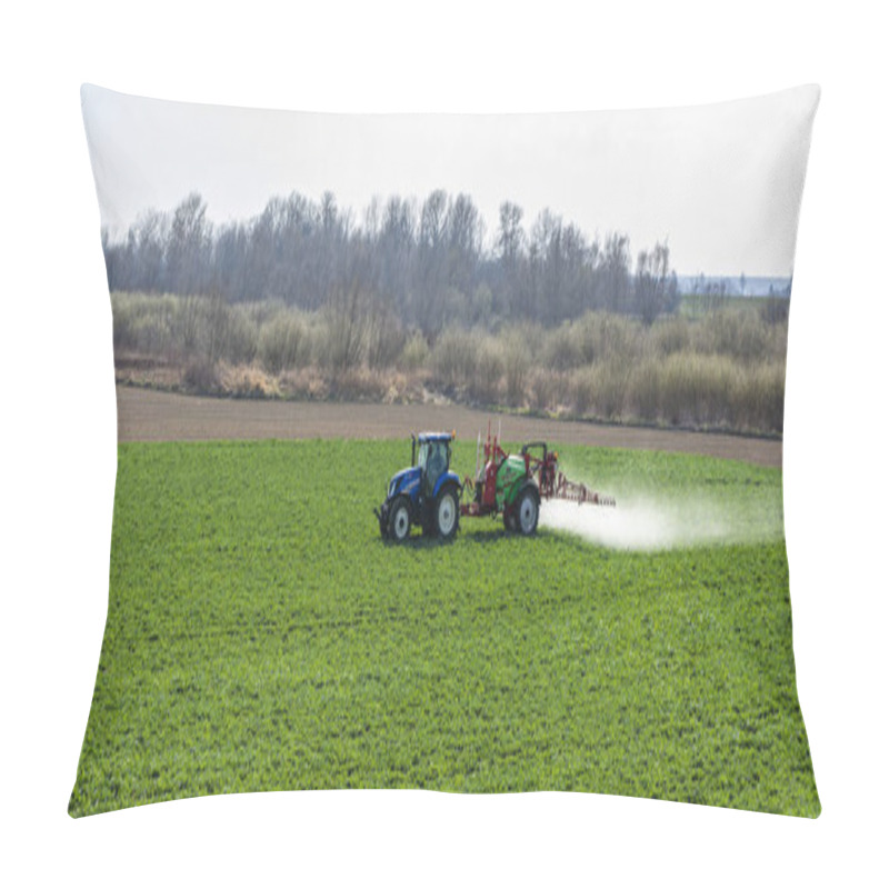 Personality  Nieciecza, Poland - March 28, 2020: Blue New Holland Tractor With Green Sprayer Krukowiak During Spraying In Spring With Rapeseed. Pillow Covers