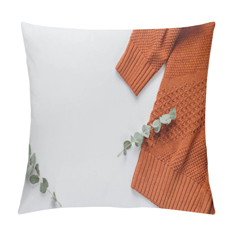 Personality  Winter Composition. Orange Sweater And A Branch Of Eucalyptus On A White Background. Autumn, Winter Concept. Flat Lay, Top View, Copy Space Pillow Covers