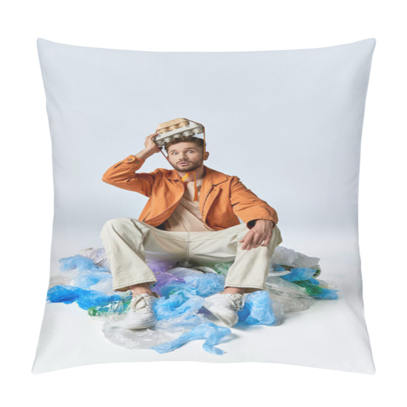 Personality  A Man Sits Amidst A Sea Of Plastic, A Cardboard Egg Carton Perched Atop His Head. Pillow Covers