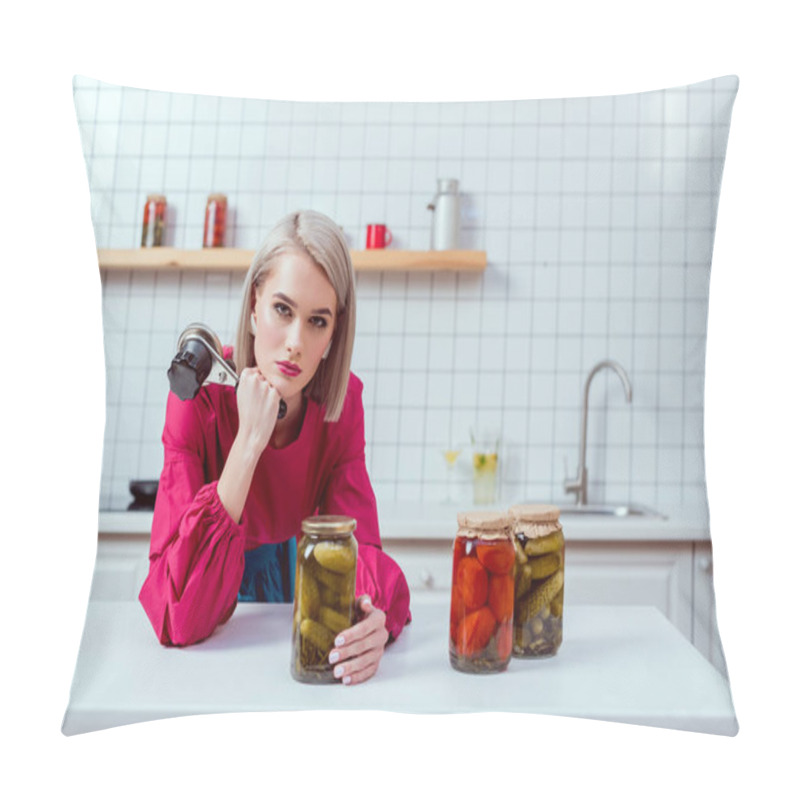 Personality  Beautiful Fashionable Housewife Looking At Camera And Holding Seamer With Jars Of Pickled Vegetables On Kitchen Counter Pillow Covers