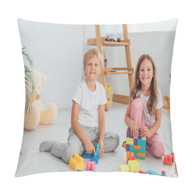 Personality  Excited Brother And Sister In Pajamas Sitting On Floor Near Building Blocks And Looking At Camera Pillow Covers