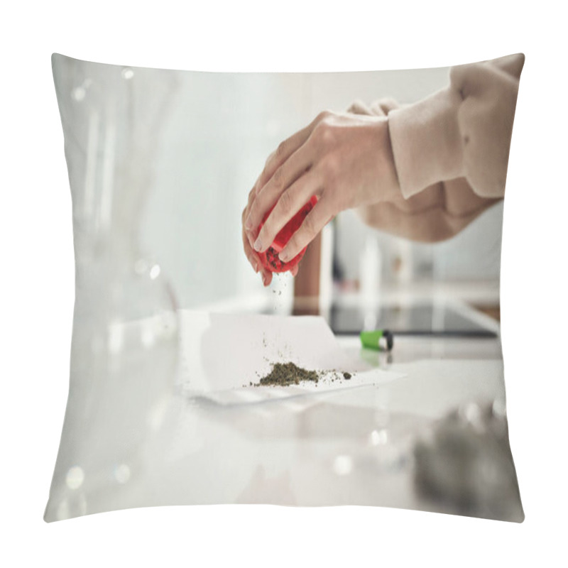 Personality  Close Up Of Womans Hands Putting Grinded Weed On A Paper While Emptying Out Red Marijuana Grinder. Glass Water Pipe Or Bong And Lighter On The Table Pillow Covers