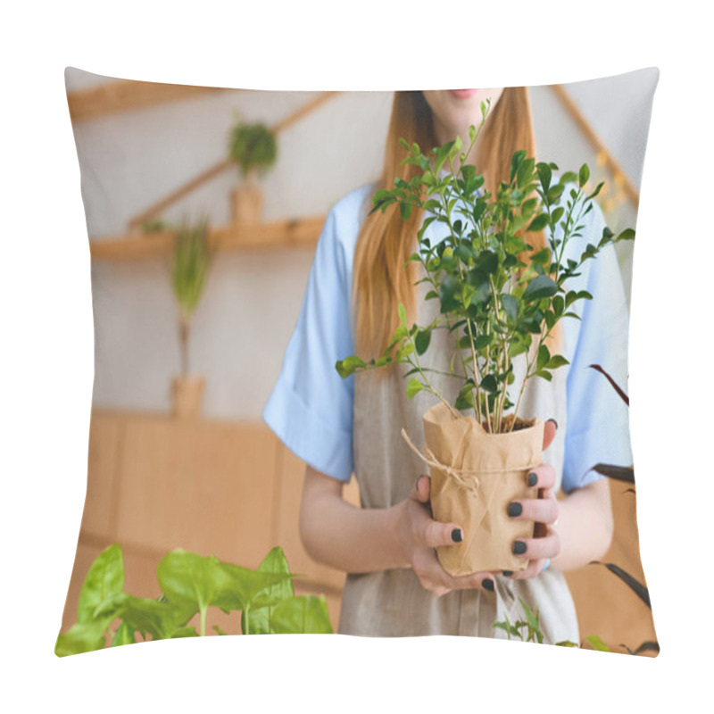 Personality  Cropped Shot Of Smiling Young Florist Holding Green Houseplant In Flower Shop Pillow Covers