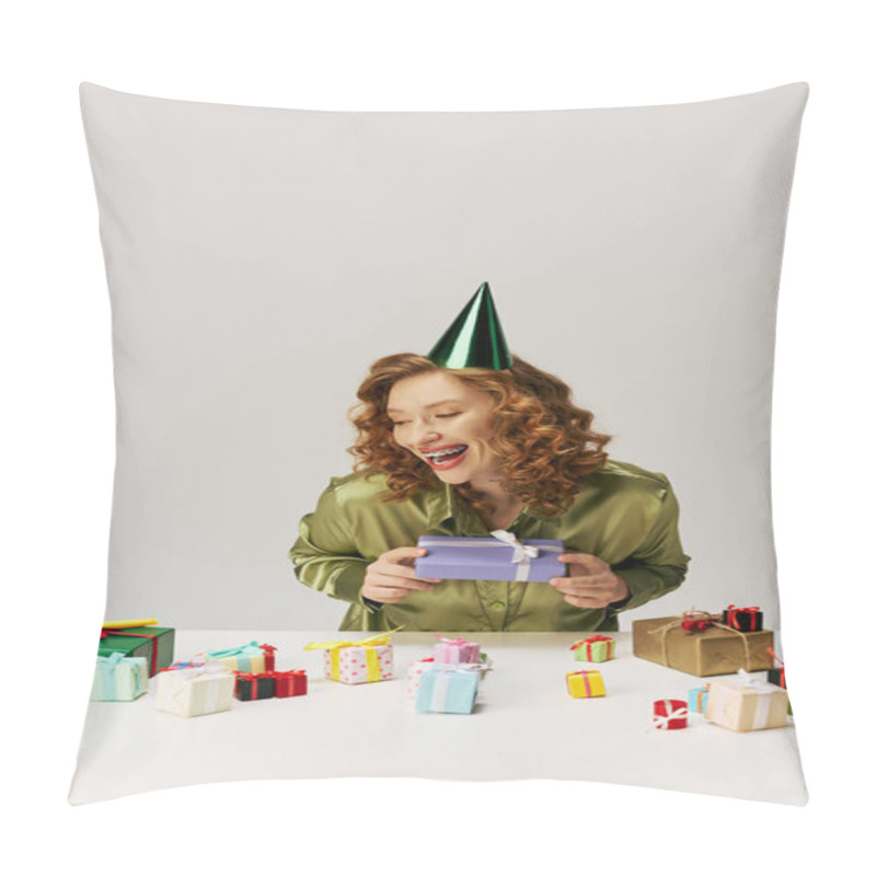 Personality  A Young Woman With Curly Hair Smiles As She Unwraps A Beautifully Wrapped Gift Surrounded By Others. Pillow Covers