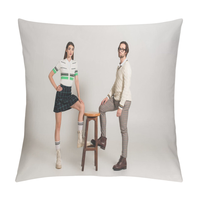 Personality  Trendy Young Couple Looking At Camera While Posing Near High Stool On Grey Background Pillow Covers