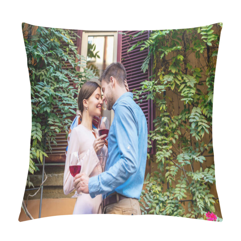 Personality  Happy Couple Embracing With Closed Eyes And Holding Glasses Of Red Wine While Standing Near House Covered With Green Ivy Pillow Covers