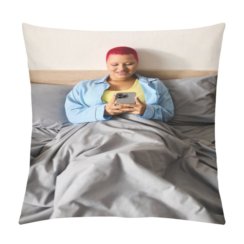 Personality  A Young Woman Smiles At Her Smartphone, Nestled Under Soft Blankets In Her Bedroom. Pillow Covers