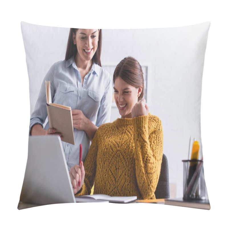 Personality  Excited Teenage Girl Holding Pen While Doing Homework Near Laptop And Mother With Book  Pillow Covers