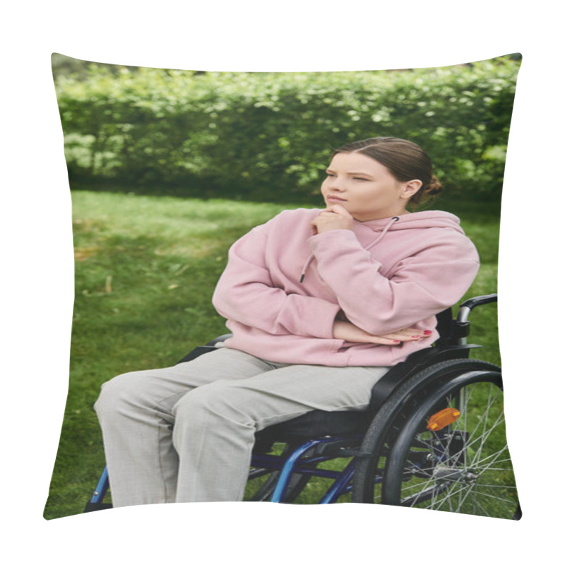 Personality  A Young Woman In A Pink Hoodie Sits Thoughtfully In A Wheelchair Outdoors. Pillow Covers