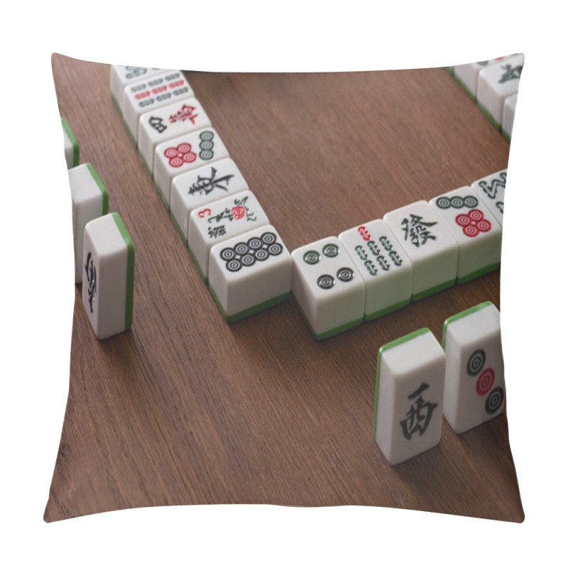 Personality  KYIV, UKRAINE - JANUARY 30, 2019: Frame And Rows Of Mahjong Game Tiles On Wooden Surface Pillow Covers