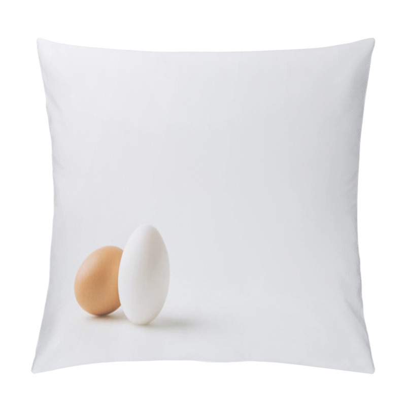 Personality  One White And One Brown Eggs Laying On White Background Pillow Covers