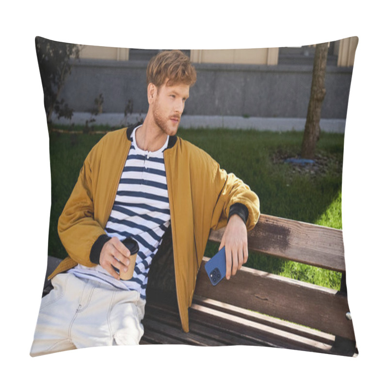 Personality  A Young Red-haired Man In Debonair Attire Sits On A Wooden Bench In A Serene Park Setting. Pillow Covers