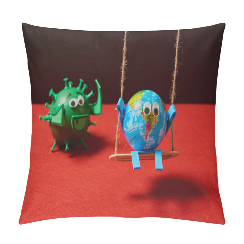 Personality  Conceptual Image Of A Toy Green Virus Behind A Toy Earth That Is Going To Catch To The Earth That Is Unprepared Having Fun On A Swing On A Black And Red Background. Pillow Covers