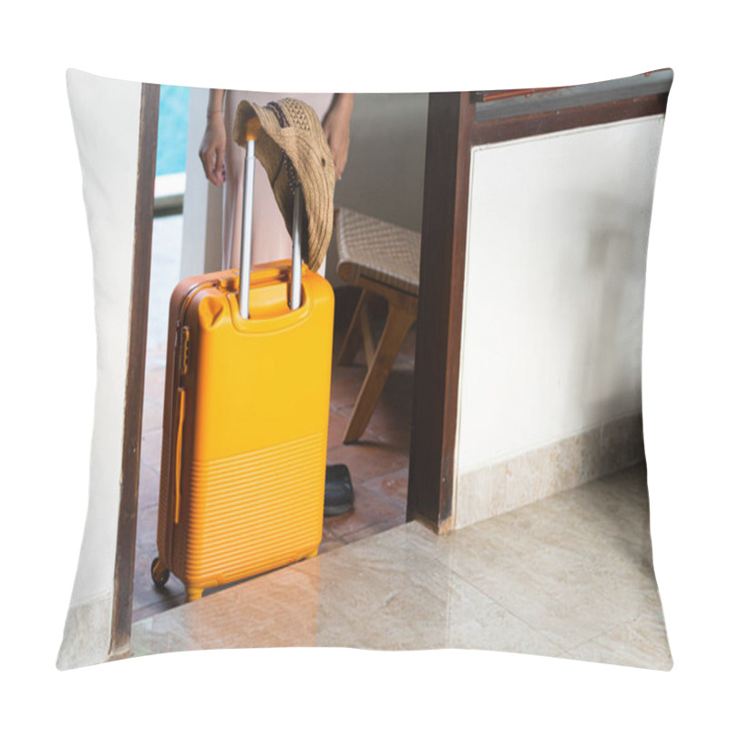 Personality  A Woman Walking By A Poolside With An Orange Suitcase, Wearing A Hat And Stylish Outfit. The Background Features Lush Greenery And A Wooden Structure, Creating A Tropical Vacation Vibe. Pillow Covers