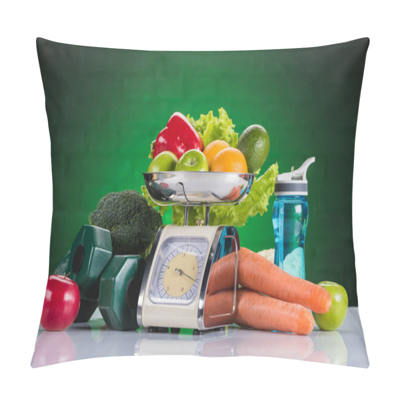 Personality  Close-up View Of Fresh Fruits And Vegetables On Scales, Dumbbells And Bottle Of Water On Green Pillow Covers