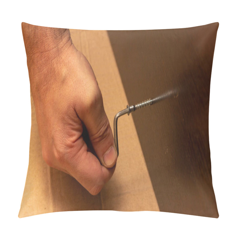 Personality  Male Hand Tightens The Screw With A Hex Wrench In Dark Brown Laminated Chipboard, Furniture Assembly Pillow Covers