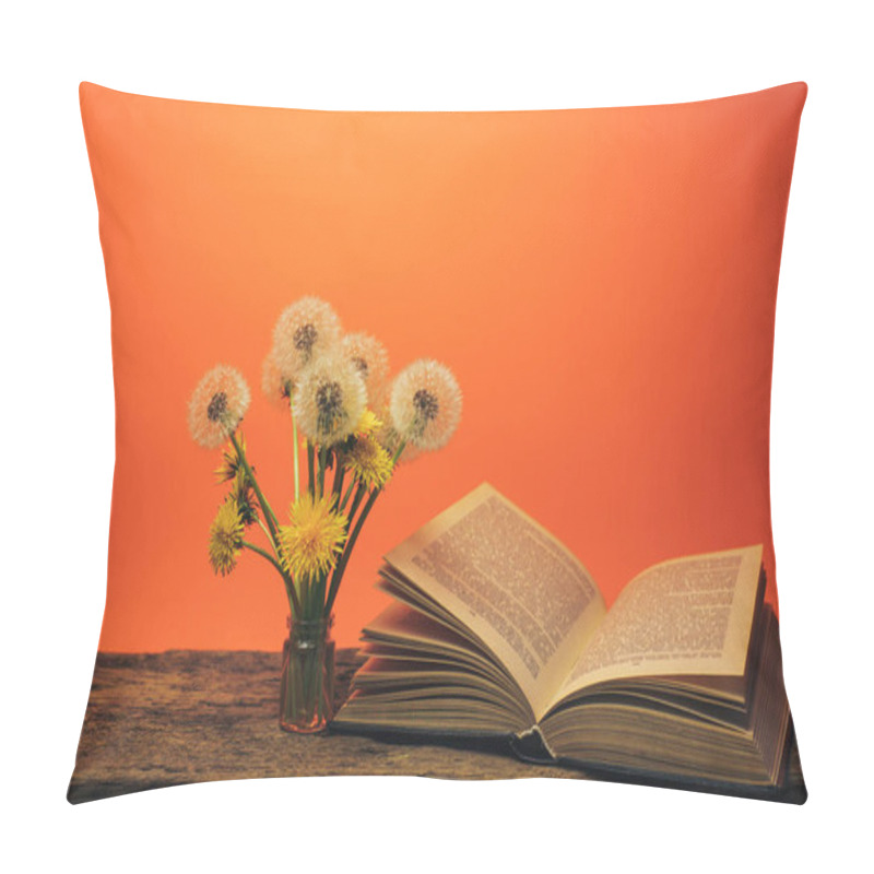 Personality  Open Book And  Yellow Flower Dandelion On A Old Oak Table And Coral Orange  Wall Background. Pillow Covers