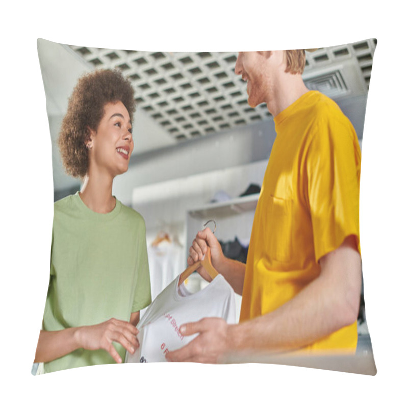 Personality  Smiling Young Multiethnic Designers Talking And Looking At Each Other While Holding T-shirt With Lettering On Hanger And Working In Print Studio, Start-up Innovation Concept Pillow Covers