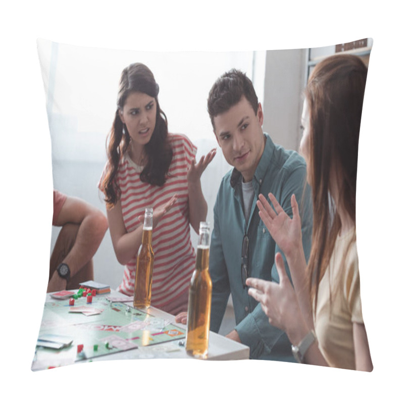 Personality  KYIV, UKRAINE - JANUARY 27, 2020: Displeased Girls Gesturing Near Confused Man While Playing Monopoly Game Pillow Covers