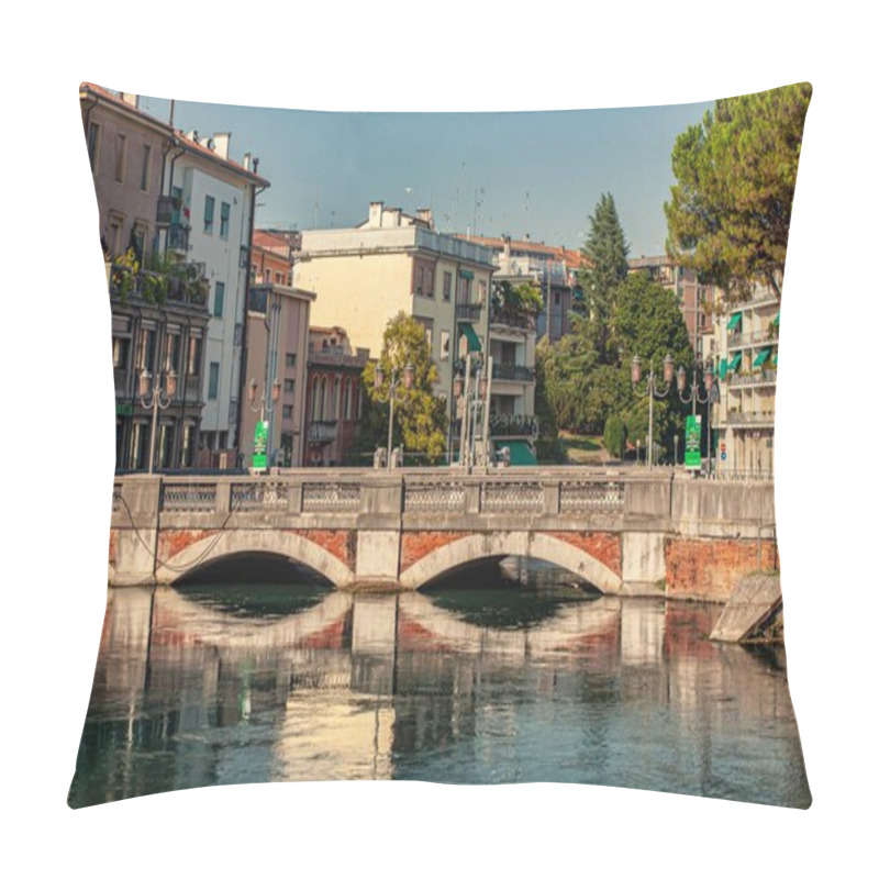 Personality  Treviso, Italy 1 January 2025: Scenic View Of A Bridge Spanning The Cagnan Grande Canal In Treviso, Italy, Featuring Reflections Of Buildings And Trees In The Water Pillow Covers