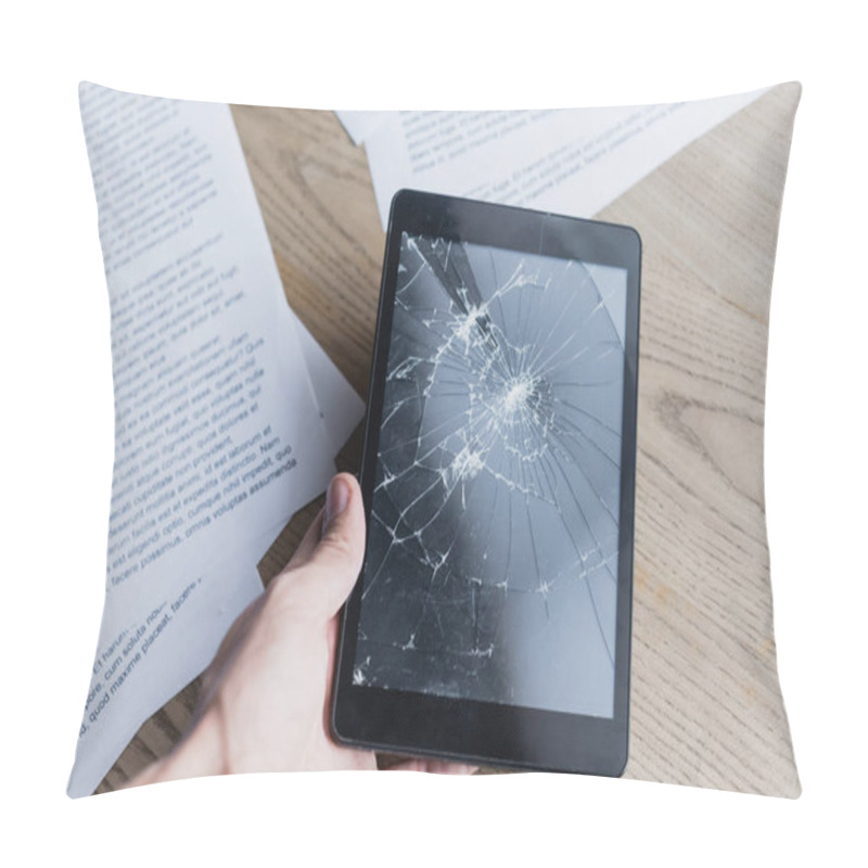 Personality  Cropped View Of Businessman Holding Smashed Digital Table Near Documents On Wooden Background Pillow Covers