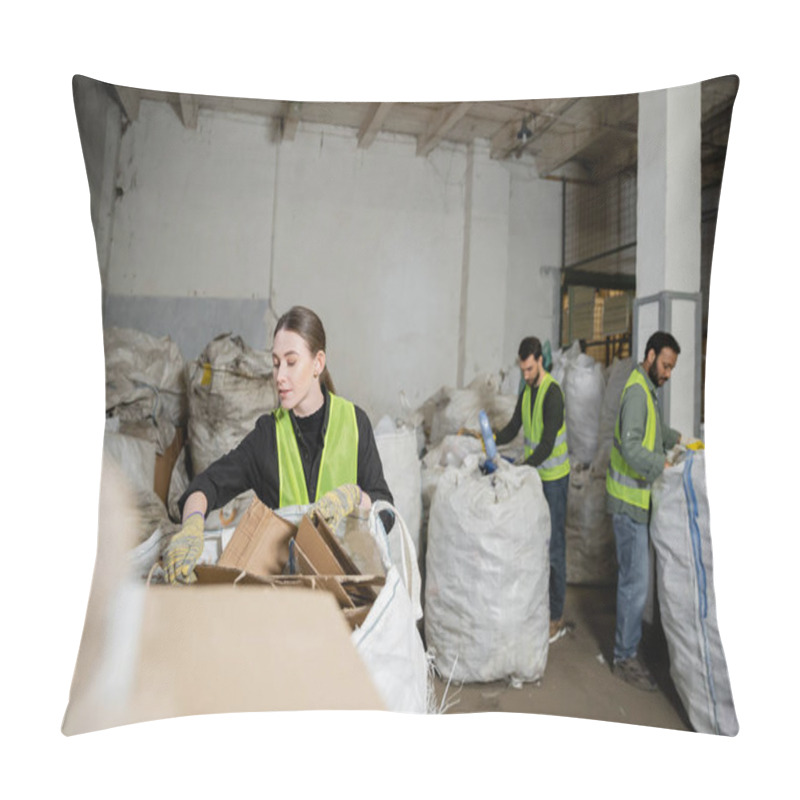 Personality  Young Sorter In Vest And Protective Gloves Putting Cardboard In Sack Near Blurred Multiethnic Colleagues In Waste Disposal Station, Garbage Sorting And Recycling Concept Pillow Covers