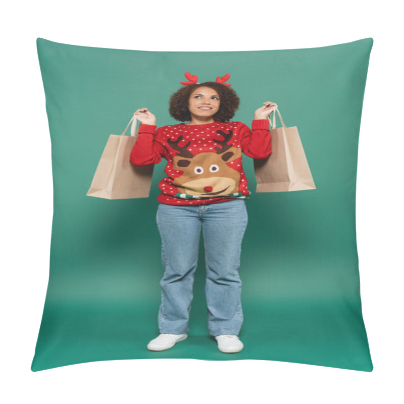 Personality  Smiling And Dreamy African American Woman In Christmas Outfit Holding Shopping Bags And Looking Away On Green Background Pillow Covers