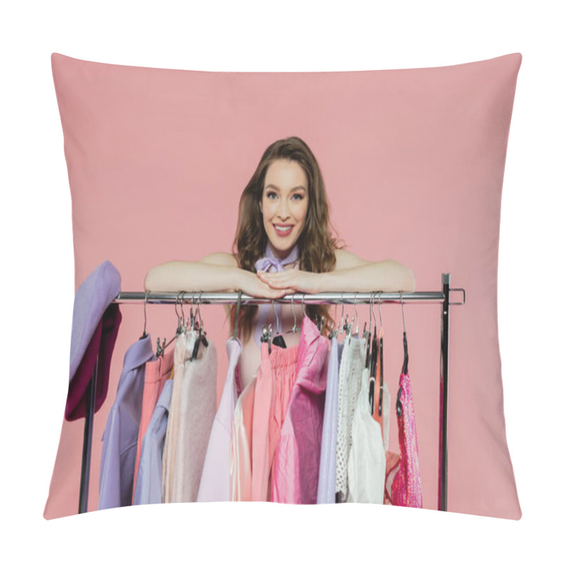 Personality  Consumerism, Cheerful Young Woman With Brunette Wavy Hair Standing Near Rack With Clothes, Wardrobe Selection Concept, Fashion And Trends, Beautiful Model Looking At Camera On Pink Background  Pillow Covers