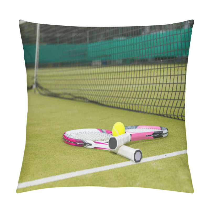 Personality  Two Tennis Rackets With A Tennis Ball Lying Near Net On A Green  Pillow Covers