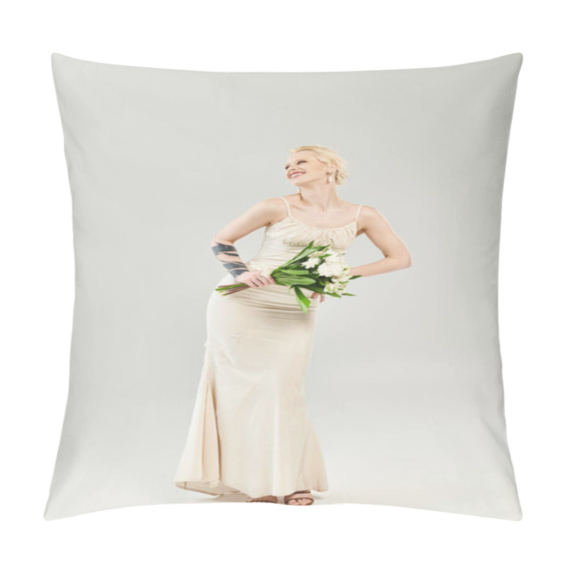 Personality  A Stunning Blonde Bride In A Wedding Dress Gracefully Holding A Vibrant Bouquet Of Flowers Against A Grey Backdrop. Pillow Covers